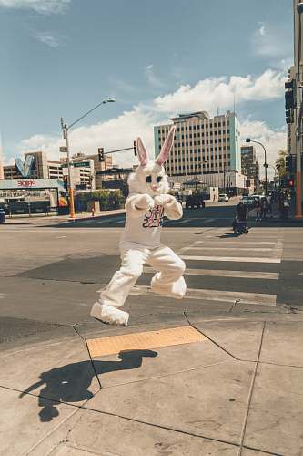 traffic light person in rabbit mascot jumping near road side las vegas